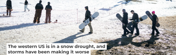 Skiers and snowboarders walk across dry ground to reach a slope at Bear Mountain ski resort on Dec. 21, 2025, in California. Eric Thayer/Los Angeles Times via Getty Images